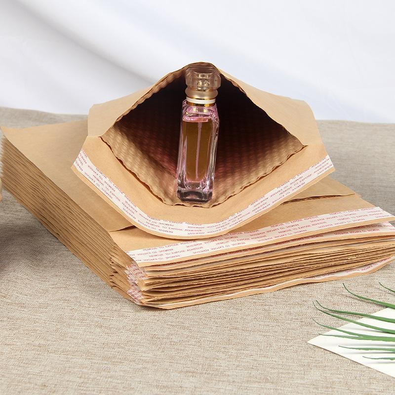 Embossed paper mailer shown with a bottle